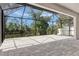 Expansive screened lanai featuring an outdoor living space with a waterfront view at 2955 Carmela Ave, North Port, FL 34286