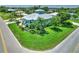 Corner lot featuring a home with a metal roof and landscaped yard, situated in a neighborhood with mature trees at 329 W Grace St, Punta Gorda, FL 33950