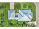 Stunning aerial view showcasing the home's architectural details and lush landscaping with an outdoor living area at 329 W Grace St, Punta Gorda, FL 33950