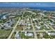 Expansive aerial view of the neighborhood, showcasing the home's location near the water and community features at 329 W Grace St, Punta Gorda, FL 33950