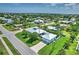 Aerial view displays this home's landscaping, garage, and neighborhood in this quiet residential area at 329 W Grace St, Punta Gorda, FL 33950