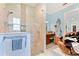 Elegant bathroom with a glass-enclosed shower featuring pebble accents and a convenient niche for toiletries at 329 W Grace St, Punta Gorda, FL 33950