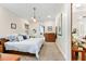 Cozy bedroom featuring soft carpeting, warm lighting, and a comfortable bed with decorative pillows at 329 W Grace St, Punta Gorda, FL 33950