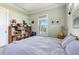 Cozy bedroom with carpet, neutral paint, and custom window shades at 329 W Grace St, Punta Gorda, FL 33950