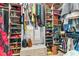 Walk-in closet with ample storage space, shelves, and hanging rods for organized clothing and accessories at 329 W Grace St, Punta Gorda, FL 33950