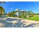 Charming home exterior with lush landscaping, a paved driveway, and a welcoming front porch at 329 W Grace St, Punta Gorda, FL 33950