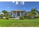 Beautiful home with well-manicured front lawn and colorful landscaping for excellent curb appeal at 329 W Grace St, Punta Gorda, FL 33950