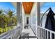 A covered front porch welcomes you to the home, featuring a light blue exterior with white posts at 329 W Grace St, Punta Gorda, FL 33950