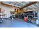 Spacious garage featuring ample storage, a vehicle, and overhead organization racks at 329 W Grace St, Punta Gorda, FL 33950