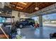 Spacious garage with overhead lighting and ample storage space and a vehicle at 329 W Grace St, Punta Gorda, FL 33950