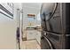 Bright laundry room features new washer and dryer, neutral paint, and custom cabinets at 329 W Grace St, Punta Gorda, FL 33950