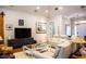 Bright living room with vaulted ceilings, hardwood floors, modern decor, and comfortable seating at 329 W Grace St, Punta Gorda, FL 33950