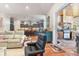 Spacious living room open to the gourmet kitchen with an island and bar stool seating at 329 W Grace St, Punta Gorda, FL 33950