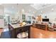 Open floorplan features hardwood floors, vaulted ceilings, skylights, and lots of natural light at 329 W Grace St, Punta Gorda, FL 33950