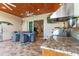 Inviting outdoor kitchen with granite countertops, stainless appliances, and a lovely dining area at 329 W Grace St, Punta Gorda, FL 33950