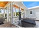 An outside, screened-in porch offers seating with an outdoor jacuzzi and lush views at 329 W Grace St, Punta Gorda, FL 33950