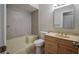 Clean bathroom featuring a tub-shower combo, neutral walls and vanity with storage at 406 Merlin Ct, Brandon, FL 33510