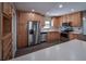 Modern kitchen with stainless steel appliances, bright cabinets, and updated countertops at 406 Merlin Ct, Brandon, FL 33510