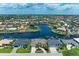 Expansive aerial view of waterfront homes with private boat docks on a canal neighborhood with easy ocean access at 414 Caicos Dr, Punta Gorda, FL 33950