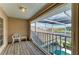 A pleasant screened in balcony with furniture and a view of the canal at 414 Caicos Dr, Punta Gorda, FL 33950