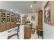 Custom wet bar includes a sink and granite countertops, perfect for cocktail preparation and entertaining guests at 414 Caicos Dr, Punta Gorda, FL 33950
