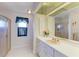 Well-lit bathroom with a glass shower, white vanity, and plenty of counter space at 414 Caicos Dr, Punta Gorda, FL 33950