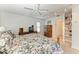 This comfortable bedroom features an older television and ceiling fan at 414 Caicos Dr, Punta Gorda, FL 33950