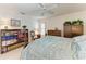 Comfortable bedroom with a bed, bookcase, chair, and view at 414 Caicos Dr, Punta Gorda, FL 33950
