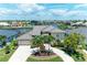 Beautiful waterfront home with lush landscaping and a circular driveway in a desirable neighborhood at 414 Caicos Dr, Punta Gorda, FL 33950