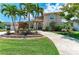 Charming home with a well-manicured lawn, elegant landscaping and a circular driveway at 414 Caicos Dr, Punta Gorda, FL 33950