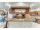 Modern kitchen with stainless steel appliances, granite countertops, and custom cabinetry at 414 Caicos Dr, Punta Gorda, FL 33950