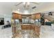 Spacious kitchen featuring granite countertops, custom cabinets, and a breakfast bar, ideal for entertaining and Gathering gatherings at 414 Caicos Dr, Punta Gorda, FL 33950