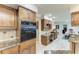 Well-appointed kitchen featuring built-in ovens and desk area, perfect for culinary enthusiasts and home organization at 414 Caicos Dr, Punta Gorda, FL 33950