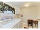 Functional laundry room with a washer, dryer, and storage cabinets at 414 Caicos Dr, Punta Gorda, FL 33950
