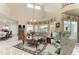 Cozy living room with a view of the pool, elegant furniture, and a floral rug at 414 Caicos Dr, Punta Gorda, FL 33950