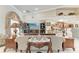 Comfortable living room featuring elegant furniture, vaulted ceilings, and an open floor plan at 414 Caicos Dr, Punta Gorda, FL 33950