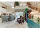 Bright living room with high ceilings, tile floors, and a cozy seating area at 414 Caicos Dr, Punta Gorda, FL 33950