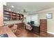 Spacious office featuring hardwood floors, built-in bookshelves, and plenty of natural light, perfect for productivity at 414 Caicos Dr, Punta Gorda, FL 33950