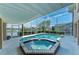 The beautiful outdoor pool features a spa and canal views at 414 Caicos Dr, Punta Gorda, FL 33950