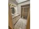 Bright bathroom featuring a walk-in shower, vanity with ample storage, and neutral finishes at 4390 Wischamper St, Port Charlotte, FL 33948