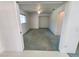 View of an empty bedroom with carpet, a ceiling fan, closet, and an attached space at 4390 Wischamper St, Port Charlotte, FL 33948