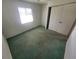 Bedroom featuring a window, closet, and carpet flooring at 4390 Wischamper St, Port Charlotte, FL 33948