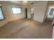 Neutral bedroom featuring carpet, an ensuite bathroom, and a closet at 4390 Wischamper St, Port Charlotte, FL 33948