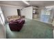 Cozy living room featuring plush seating, vaulted ceilings, and a sunlit atmosphere at 4390 Wischamper St, Port Charlotte, FL 33948