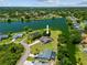 Aerial view highlighting the property's waterfront location, private pool, and lush landscaping at 501 Fairmont Ter, Port Charlotte, FL 33954