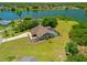Aerial view highlighting the home's expansive backyard, pool area, and waterfront views at 501 Fairmont Ter, Port Charlotte, FL 33954