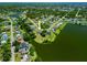 Aerial view showcasing property's waterfront location, lush landscaping and neighborhood layout at 501 Fairmont Ter, Port Charlotte, FL 33954
