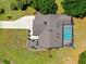 Aerial view showcasing a pool and landscaped yard highlighting the layout of the home at 501 Fairmont Ter, Port Charlotte, FL 33954