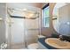 Bright bathroom featuring glass shower, toilet and vanity with sink at 501 Fairmont Ter, Port Charlotte, FL 33954