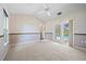 Spacious bedroom with a ceiling fan, carpet, and patio door leading to the pool at 501 Fairmont Ter, Port Charlotte, FL 33954